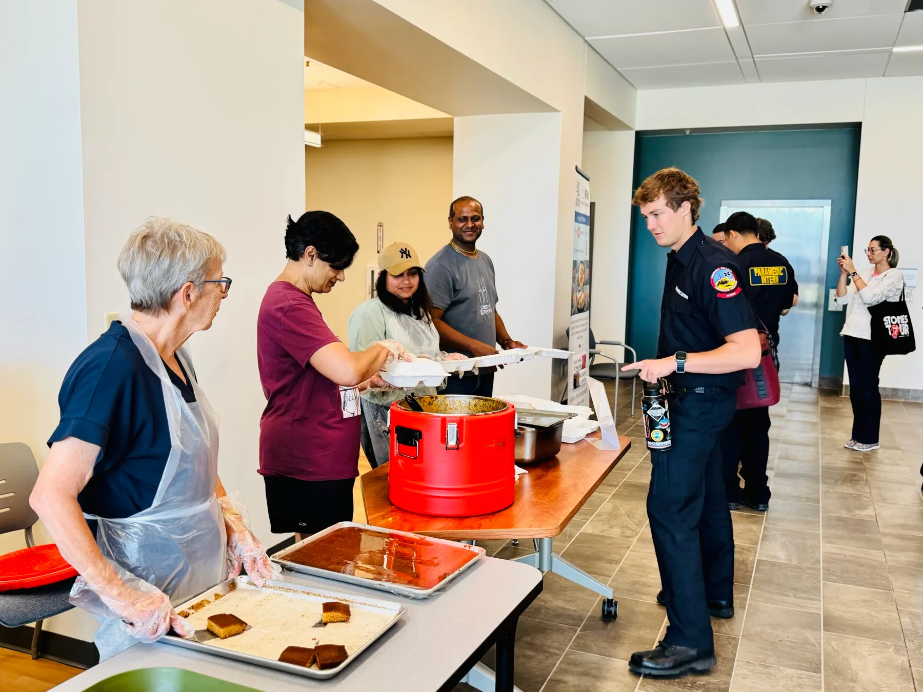 Volunteers serving hot meals to students